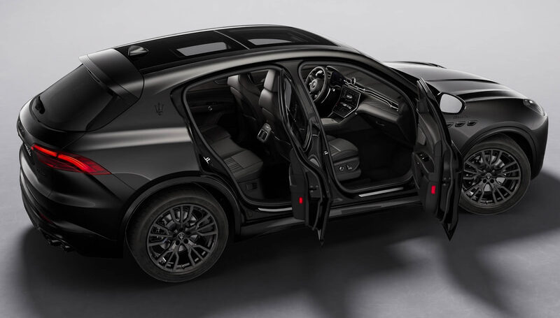 Black Maserati SUV with all doors open, exposing a luxury interior and panoramic sunroof.