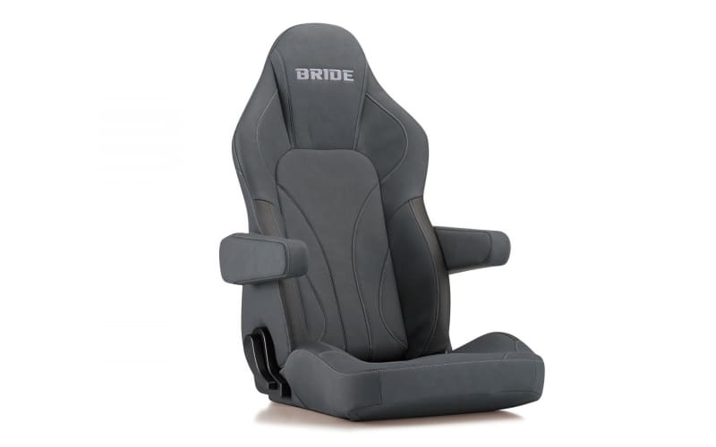Grey racing car seat with padded side bolsters and armrests, BRIDE logo at the headrest.