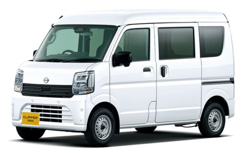 Front-side view of a white cargo van with a sliding door and yellow 'Clipper Van' plate on the bumper