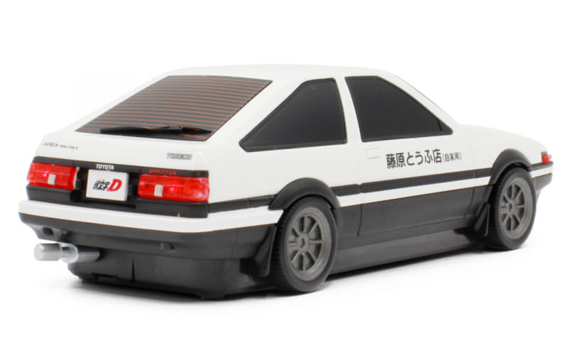 White two-tone (white and black) toy model car, rear-left view with Japanese text decals on the side and rear window louvers