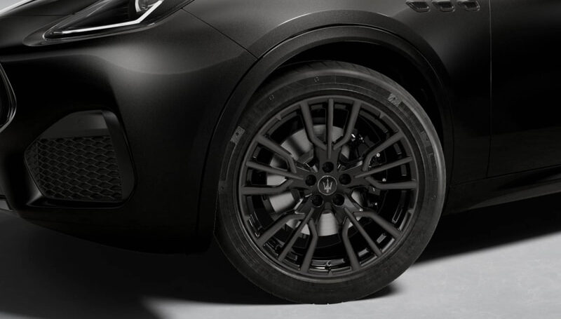 Close-up of a black Maserati Levante front-left wheel with a large dark alloy rim and brake calipers.
