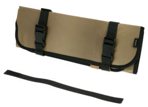 Tan roll-up tool pouch with black buckles and a detachable strap lying in front.