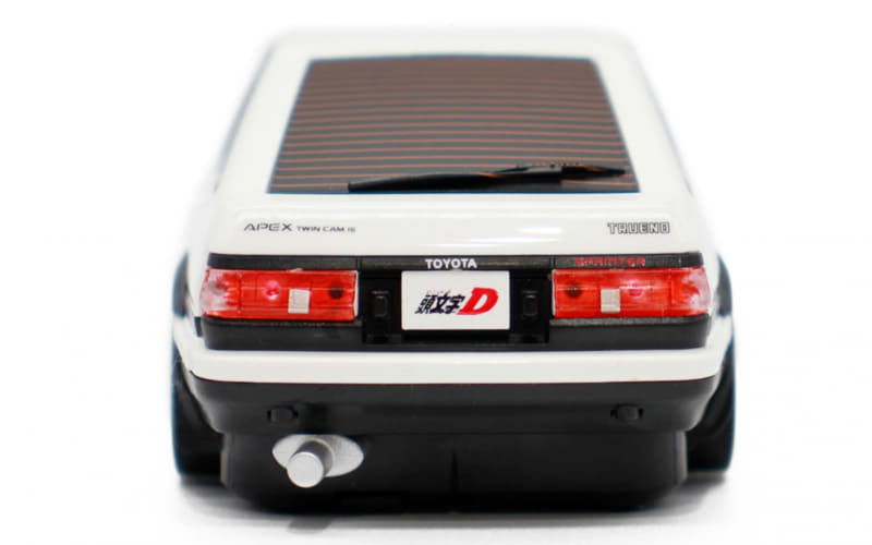 Rear view of a white Toyota Trueno toy car with a solar panel on the roof.