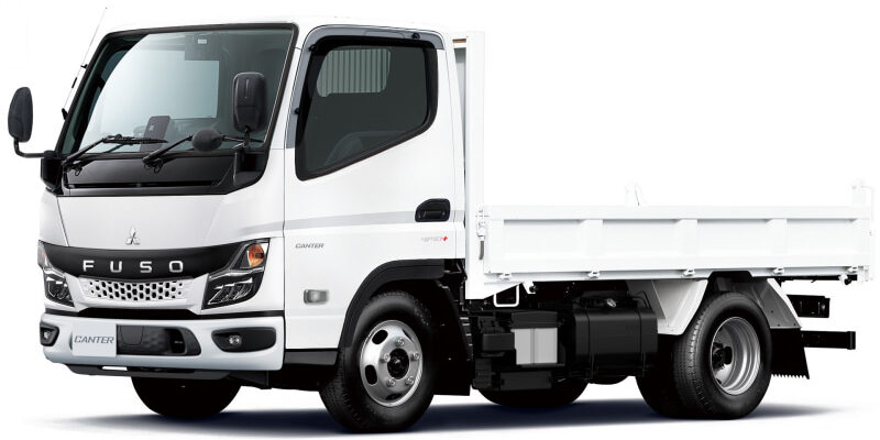 White Mitsubishi Fuso Canter dump truck, left-side view showing cab and empty cargo bed.