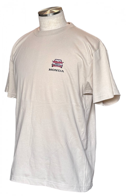 Beige short-sleeve T-shirt on a mannequin with a small red Honda emblem on the left chest.