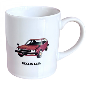 White ceramic mug featuring a small red Honda car illustration with the word HONDA beneath it, on the side of the mug.
