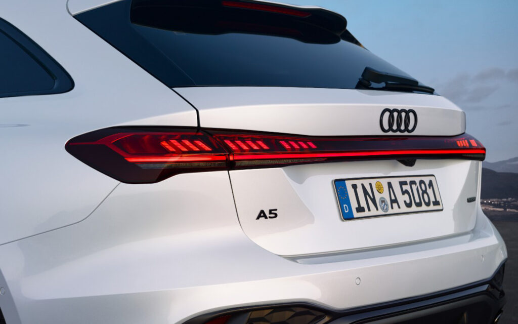 Rear view of a white Audi A5 showing the distinctive red taillights and European license plate IN A 5081