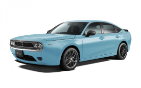 Blue four-door sedan photographed from a front-right three-quarter angle on a white background.