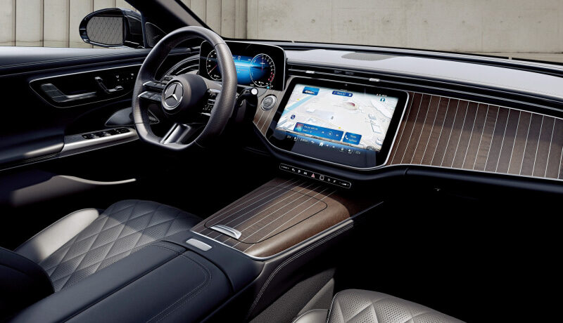 Luxurious car interior with a digital dashboard and center touchscreen showing a navigation map in a premium sedan park view