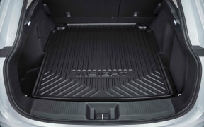 Open trunk of an SUV with a textured rubber cargo mat in place.