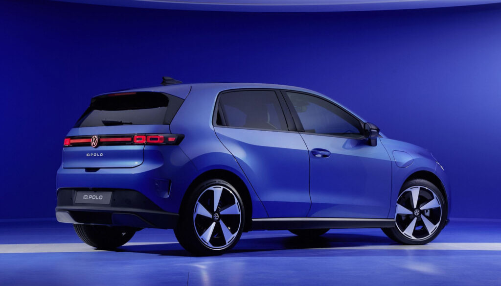 Blue Volkswagen ID. Polo hatchback shown from rear three-quarter view in a blue studio backdrop with glossy floor.
