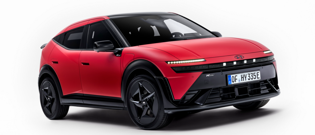 Front-right three-quarter view of a red Hyundai N Line crossover with black trim and large black wheels.