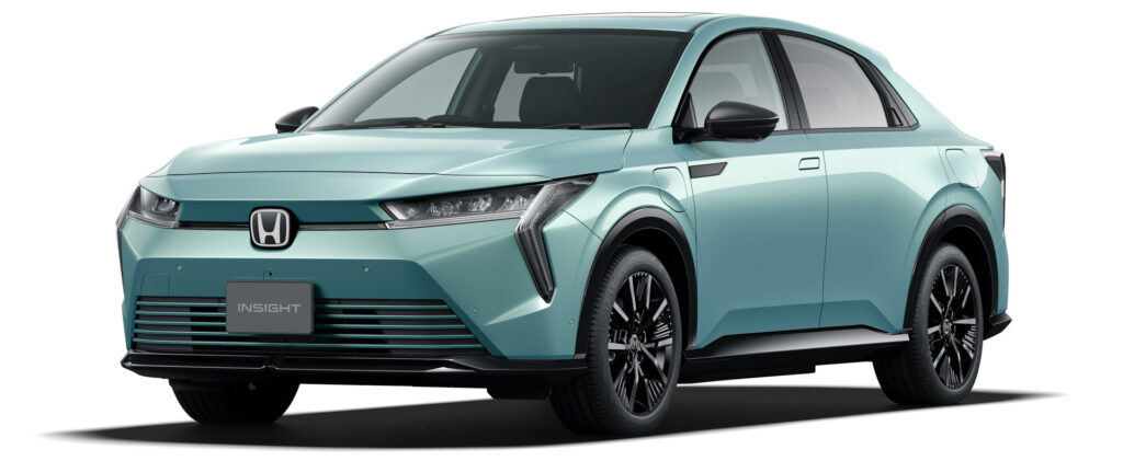 Front three-quarter view of a turquoise Honda Insight hatchback with sleek headlights and black grille accents.